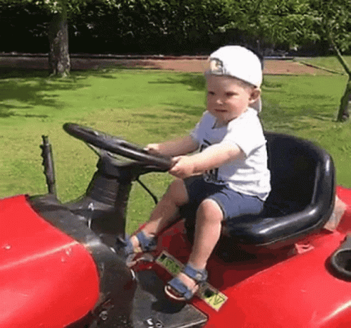 Boy Sitting On Red Lawn Mower GIF