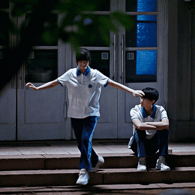 Boy Sitting On Steps Girl Standing At Door GIF