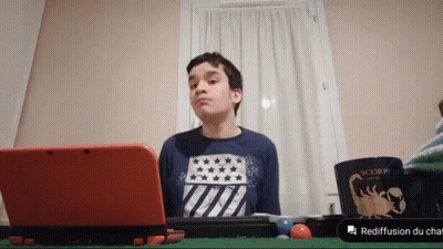 Boy Sitting With Red Nintendo 3DS And Scorpion Mug GIF