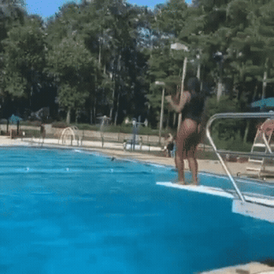 Boy Standing On Man's Shoulders In Pool GIF