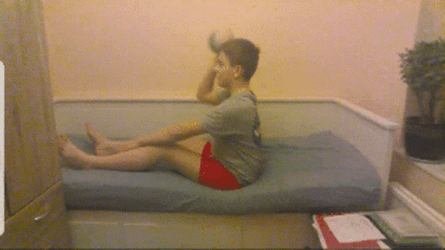 Boy Throwing Computer While Sitting GIF