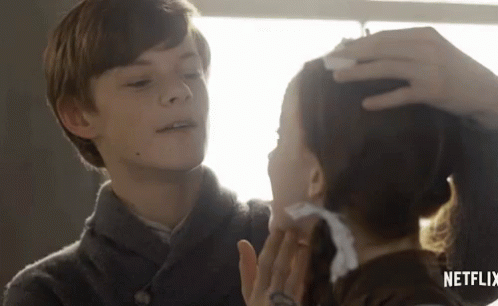 Boy Touching Girl's Forehead In Netflix Ad GIF