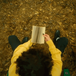 Boy Turning Flipbook Pages GIF