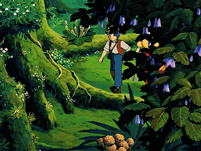 Boy Walking Through Lush Green Forest With Purple Flowers GIF