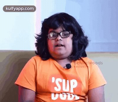 Boy Wearing Glasses And Orange Shirt Saying Sup Dude GIF