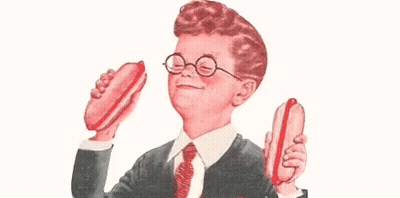 Boy Wearing Glasses And Tie Holding Two Hot Dogs GIF