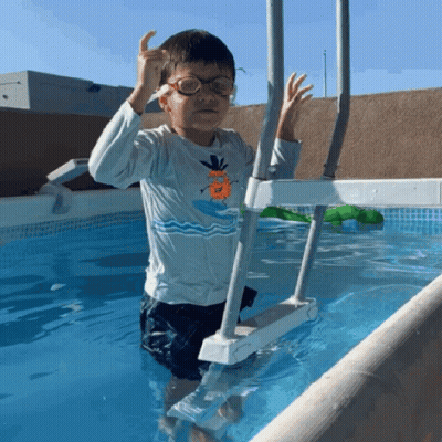 Boy Wearing Glasses Standing In Pool GIF