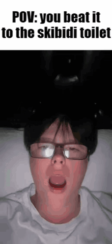 Boy Wearing Headphones Holding Phone GIF