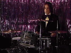 Boy Wearing Suit Playing Rim Shot GIF