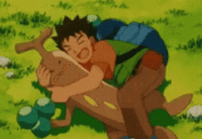 Boy With Backpack Hugging Brown Animal In Grass GIF