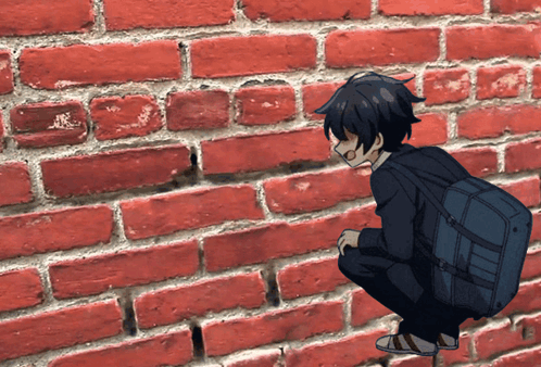 Boy With Backpack Squatting Against Brick Wall GIF