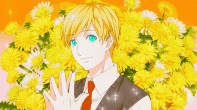 Boy With Blue Eyes Surrounded By Yellow Flowers GIF