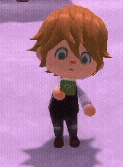 Boy With Brown Hair Holding Green Object GIF