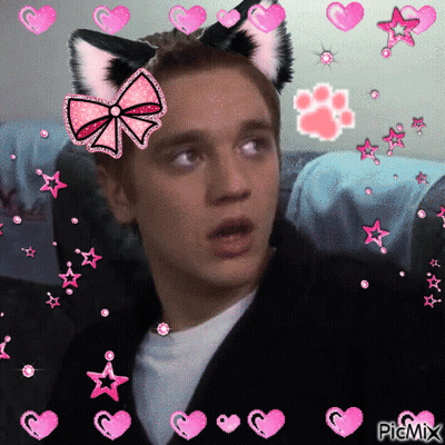 Boy With Cat Ears And Bow Surrounded By Hearts And Stars GIF
