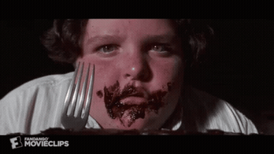 Boy With Chocolate Face Holding Fork GIF