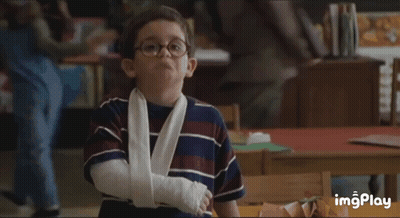 Boy With Glasses And Arm Cast In Classroom GIF