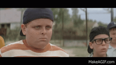 Boy With Glasses And Baseball Cap Standing Next To Another Boy GIF