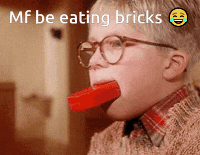 Boy With Glasses Eating Brick GIF