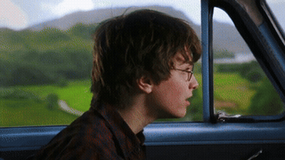 Boy With Glasses Looking Out Car Window GIF