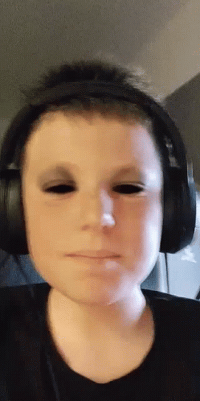 Boy With Headphones And Black Eyes Making Funny Face GIF