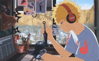 Boy With Headphones Sitting At Computer GIF