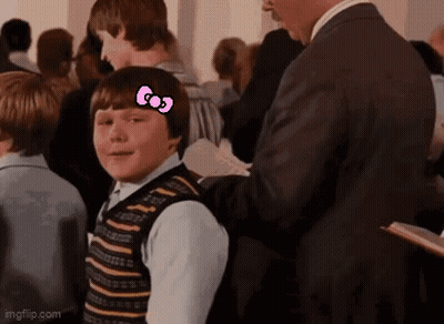 Boy With Hello Kitty Bow In Crowd GIF