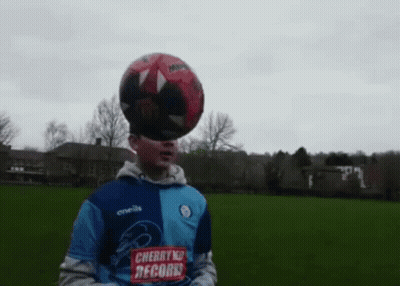 Boy With Soccer Ball On Head In Cherry Records Shirt GIF