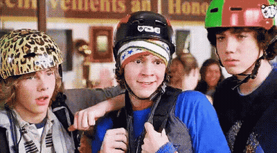 Boy With UCG Helmet Standing Next To Two Boys GIF