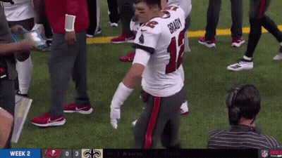 Brady Kneeling on Football Field