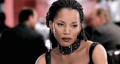 Braided Woman With Choker And Earrings Looking At Camera GIF