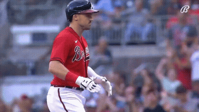 Braves Player Standing Before Scoreboard GIF