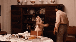 Breaking The Figurines On Top Of The Cabinet GIF