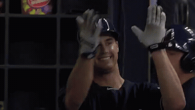 Brewers Player Arms Outstretched In Dugout GIF