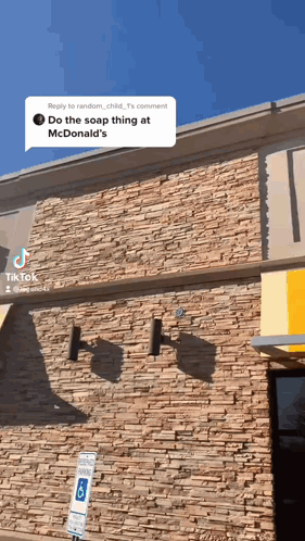 Brick Building With Yellow Awning GIF