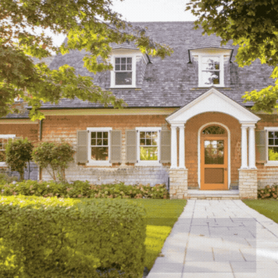 Brick House With Wooden Door And Shutters GIF