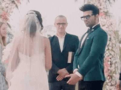 Bride And Groom Holding Hands Man In Suit Behind GIF