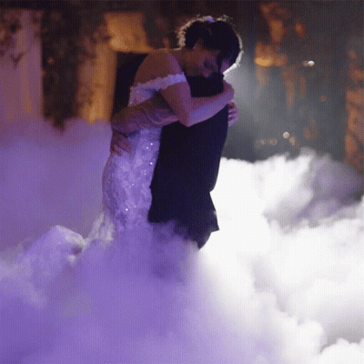 Bride And Groom Hugging In Foggy Room GIF