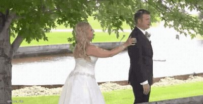Bride And Groom Hugging Under Tree GIF