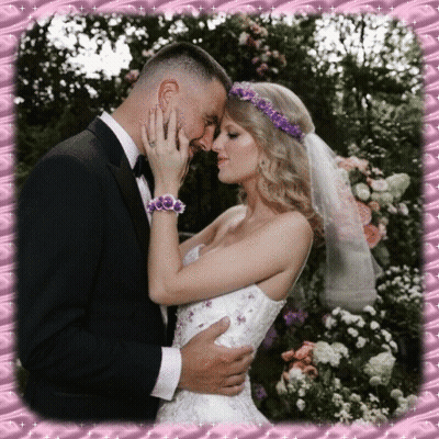 Bride And Groom Kissing In Front Of Pink Frame GIF