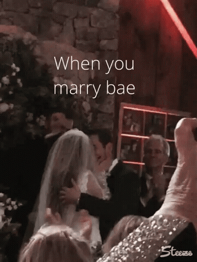 Bride And Groom Kissing With Caption When You Marry Bae GIF