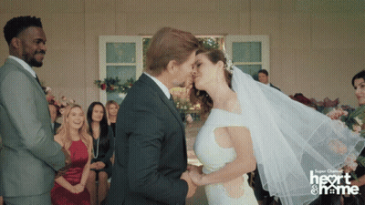 Bride And Groom Kissing With Super Channel Logo GIF