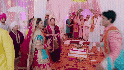 Bride And Groom Standing Before Cake GIF