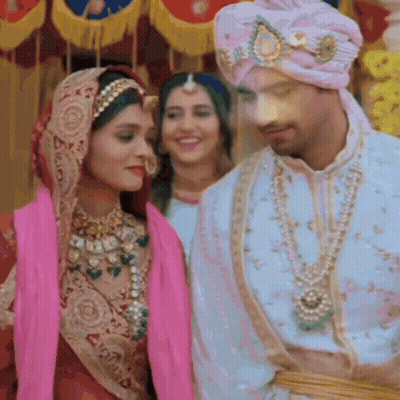 Bride And Groom Standing In Front Of Crowd GIF