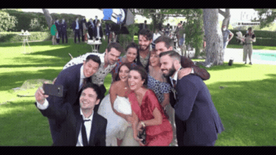 Bride And Groom Taking Selfie With Group GIF
