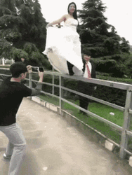 Bride Sliding Down The Fence Funny Wedding GIF