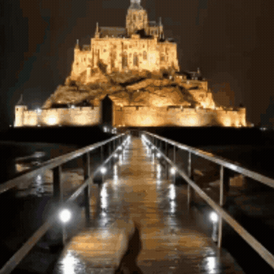 Bridge Leading To Castle At Night GIF