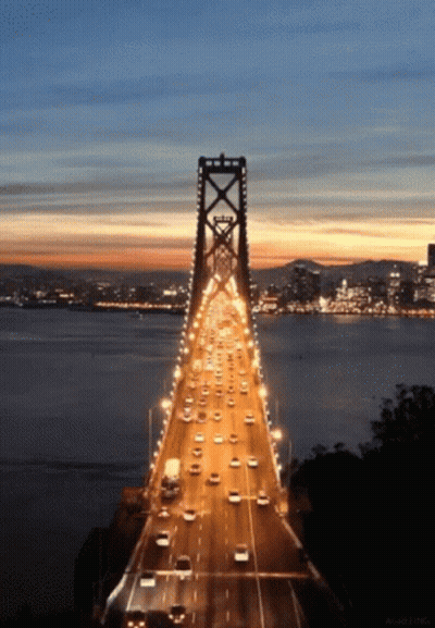 Bridge Over Water At Night GIF