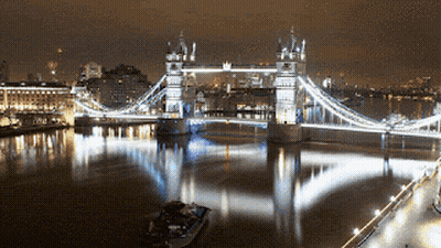 Bridge Over Water With Foreground Boat GIF