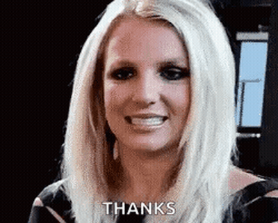 Britney Spears Is Smiling And Giving A Thanks Gesture . GIF
