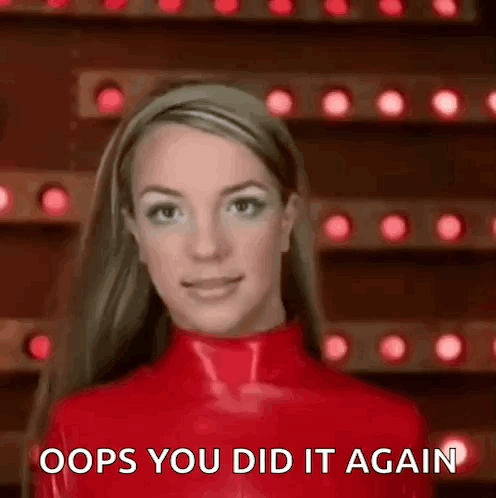 Britney Spears Is Wearing A Red Latex Outfit And Making A Funny Face . GIF